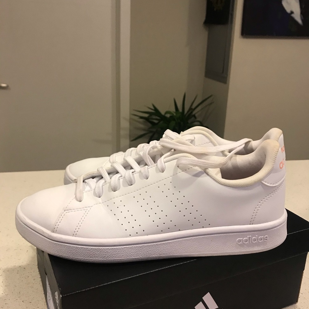 Adidas White Sneakers with Peach Colored letters.